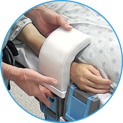 the safetuck device being secured in place on a hospital bed